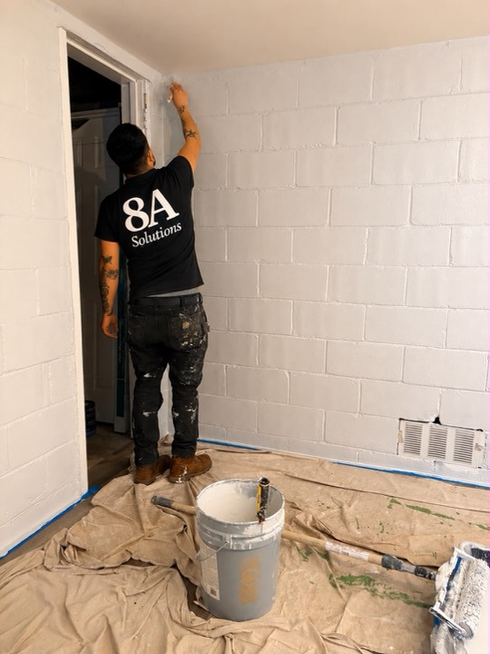 8A painter cutting in around a doorway
