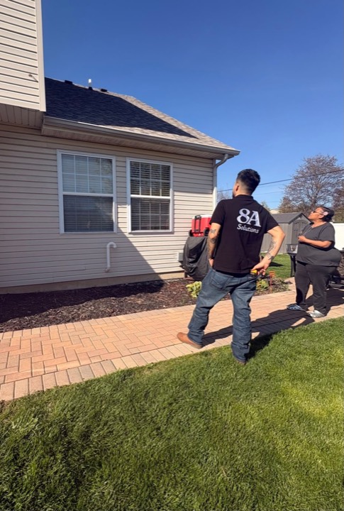8A inspecting a roof with the homeowner
